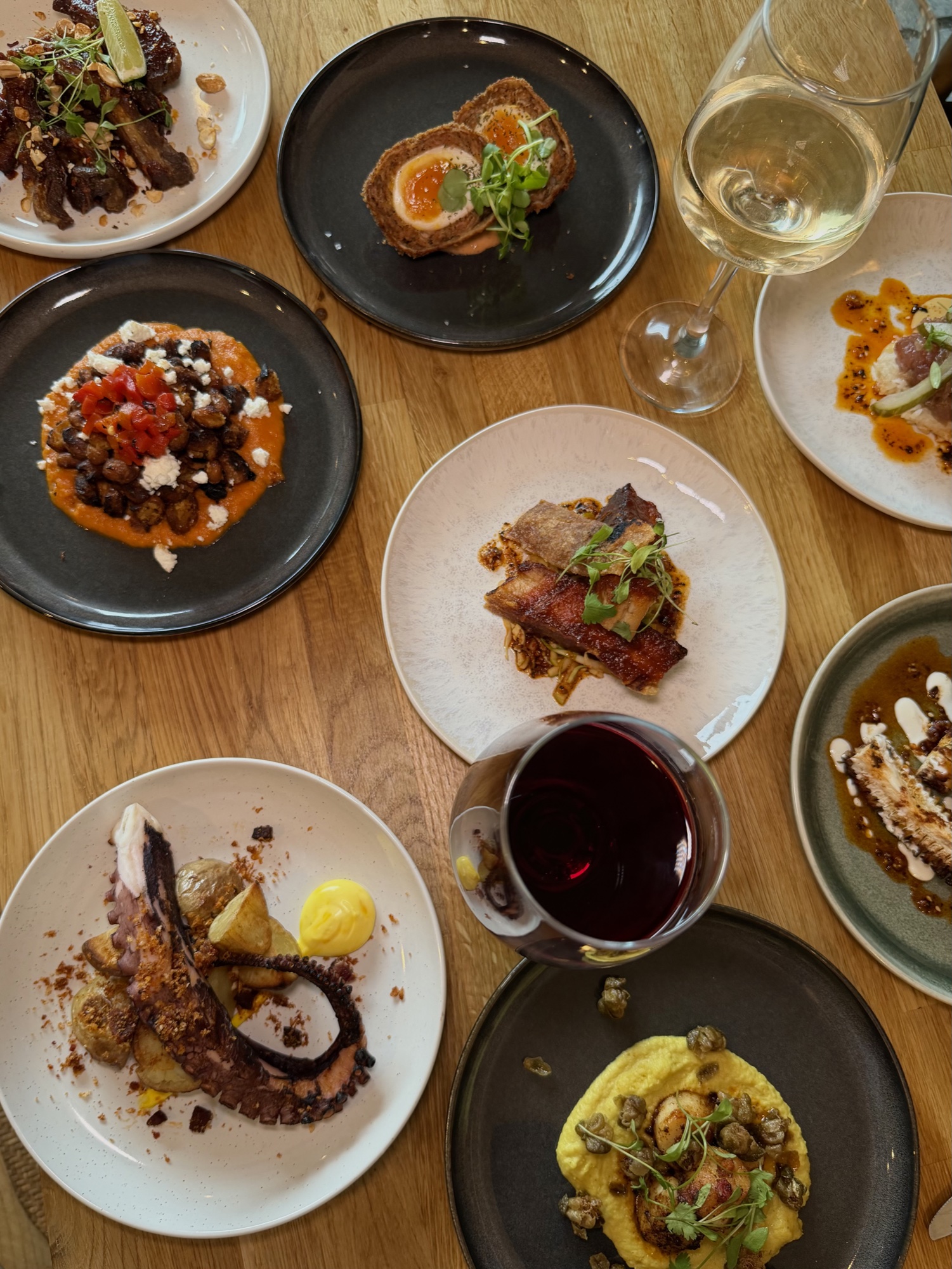 Small plates with red and white wine on the table